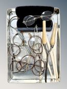 A tin of antique and later spectacles,