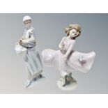 A Lladro figure of a lady with chicken,