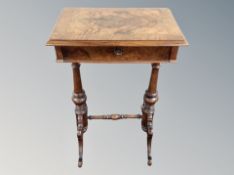 A 19th century walnut sewing table,
