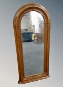 A 19th century walnut arch topped mirror,