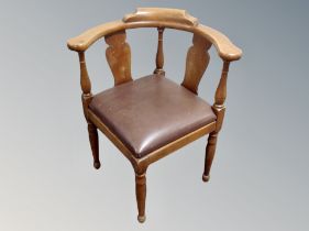 A Continental carved corner armchair