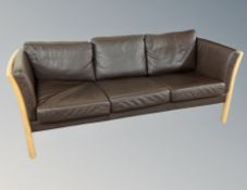 A Danish brown leather three seater