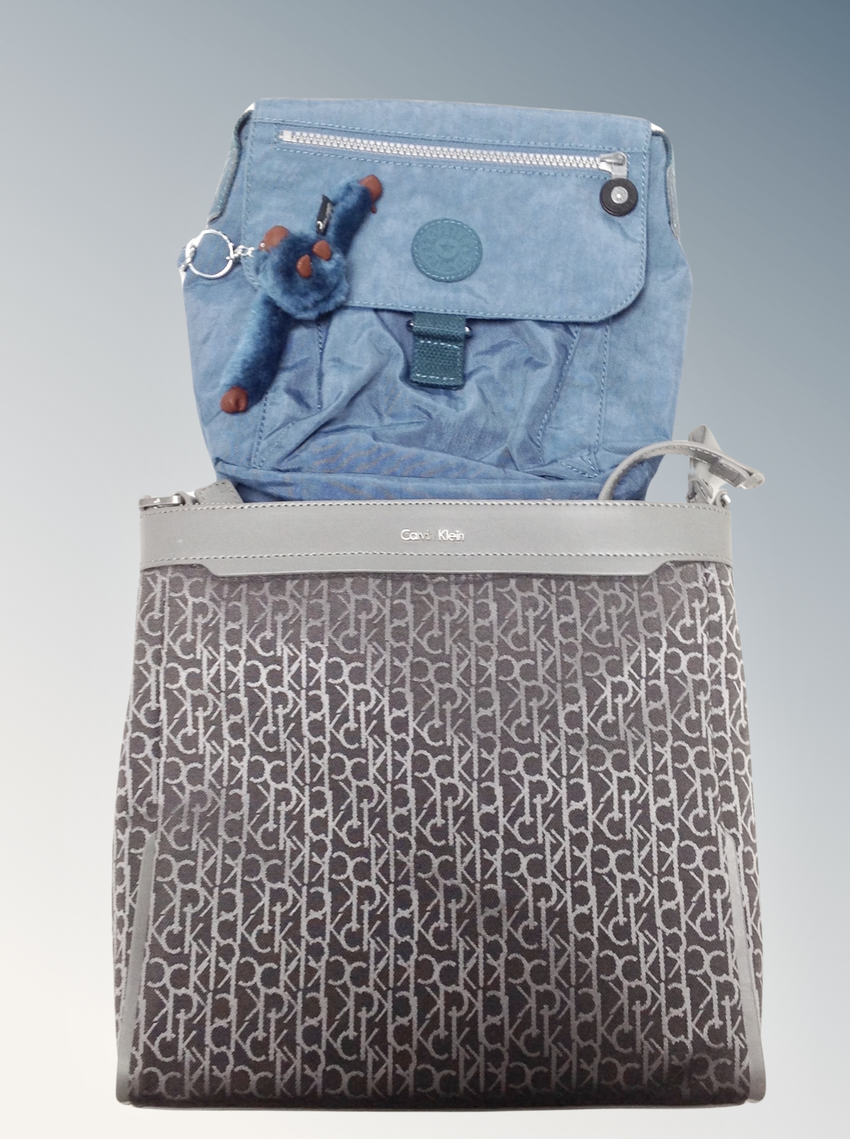 A Lady's blue leather Radley hand bag with dust cover together with a further Kipling and Calvin - Image 2 of 2