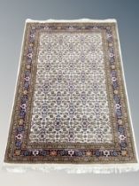 An Iranian Tabriz rug on cream ground,