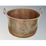 A 19th century copper twin handled vessel,