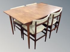 A 20th century teak dining room suite comprising of extending dining table,