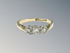 An 18ct gold three stone diamond ring, size N CONDITION REPORT: 2.