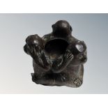 An ashtray modelled as three monkeys