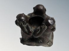 An ashtray modelled as three monkeys