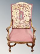 A continental heavily carved armchair