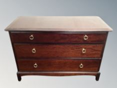 A Stag minstrel chest of three drawers,