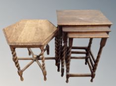 An oak hexagonal low table together with a nest of three tables