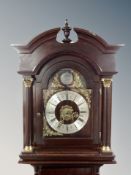 A reproduction mahogany longcase clock with pendulum and weights