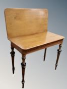 A 19th century mahogany turnover top tea table