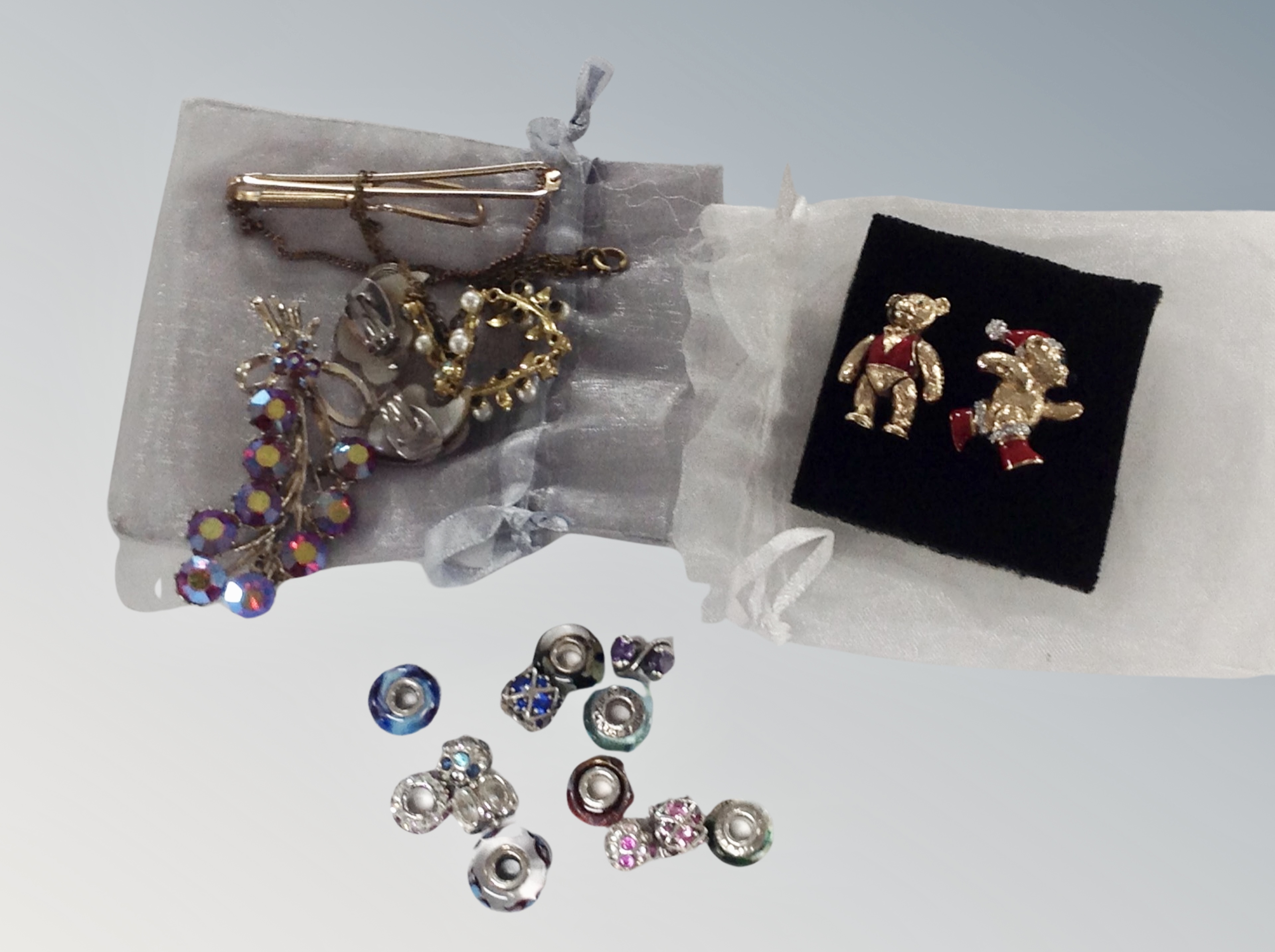 A collection of jewellery including Butler and Wilson teddy bear brooches,