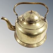 A brass kettle with lid