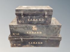 Three lacquered tin trunks