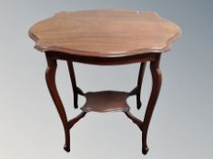 A shaped two tier occasional table