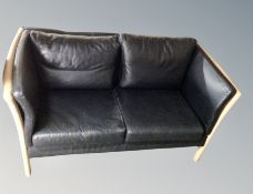 A Danish two seater black leather settee width 150 cm