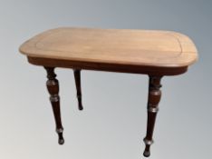 A continental mahogany occasional table