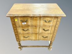 An oak three drawer low chest,