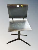 An industrial metal child's chair