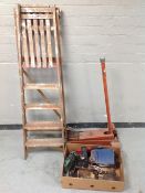A wooden step ladder, a car jack together with box of power and hand tools, Prinz binoculars,