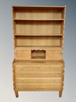 A blonde oak bookcase, fitted drawer beneath,