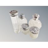 Five silver topped dressing table jars