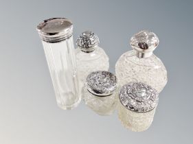 Five silver topped dressing table jars