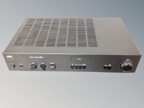 An NAD stereo amplifier 3020i with lead