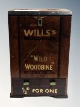 An antique and later painted Wills Woodbines cigarette box