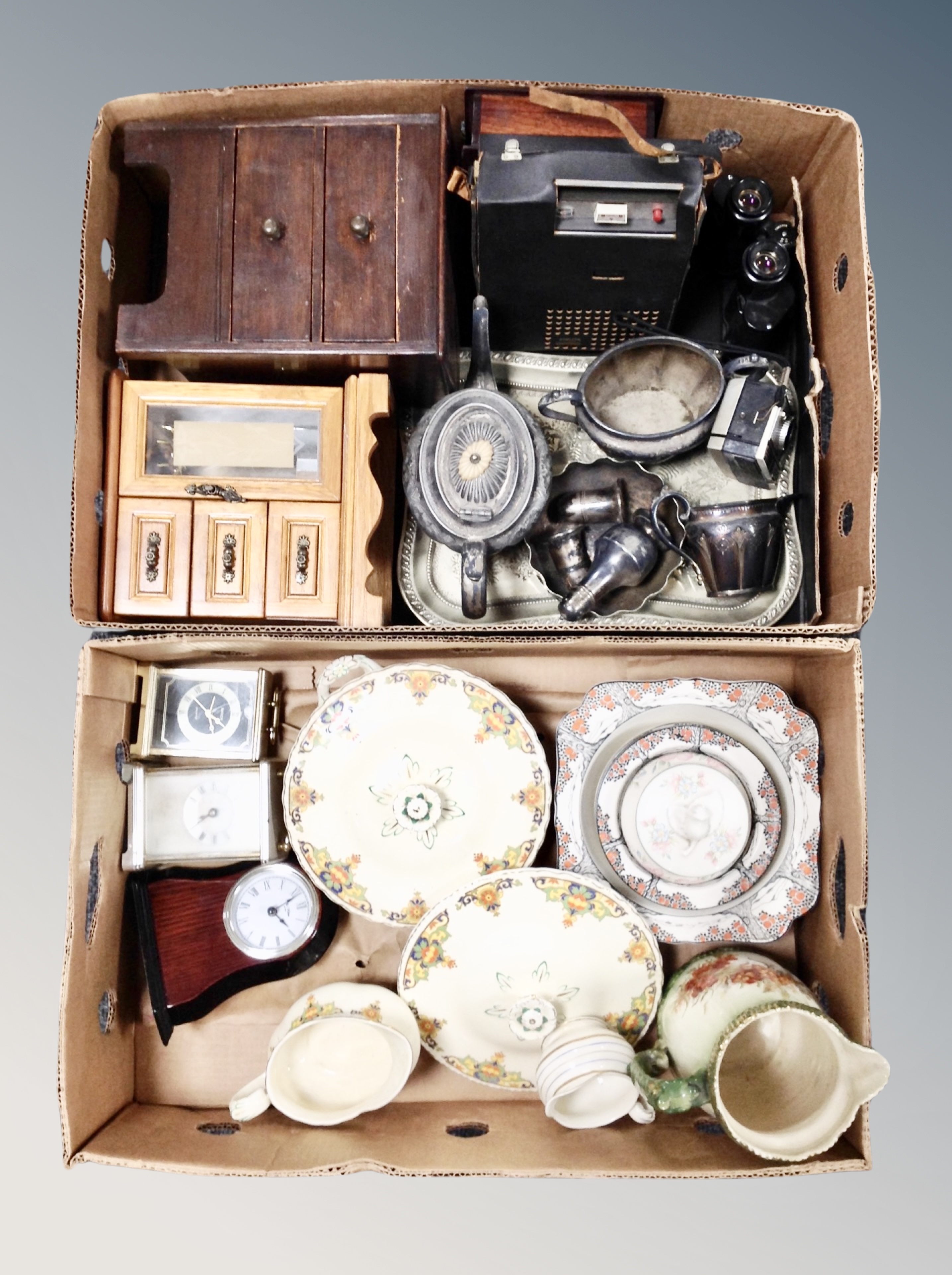 Two boxes of silver plated wares, tea set, pair of Soviet binoculars, contemporary mantel clocks,