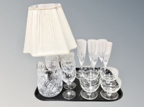 A collection of crystal, table lamp,