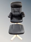 A black leather swivel armchair with footstool