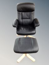 A black leather swivel armchair with footstool