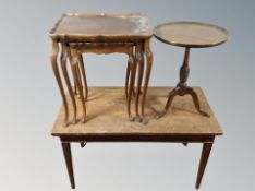 A nest of three beech tables,