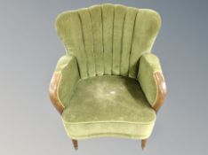 An Art Deco armchair in green dralon fabric