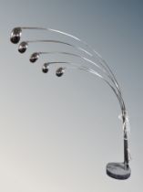 A contemporary chrome five branch floor lamp