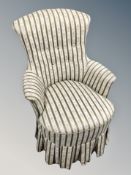 A salon chair in striped upholstery
