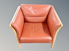 A Danish oak framed red leather armchair