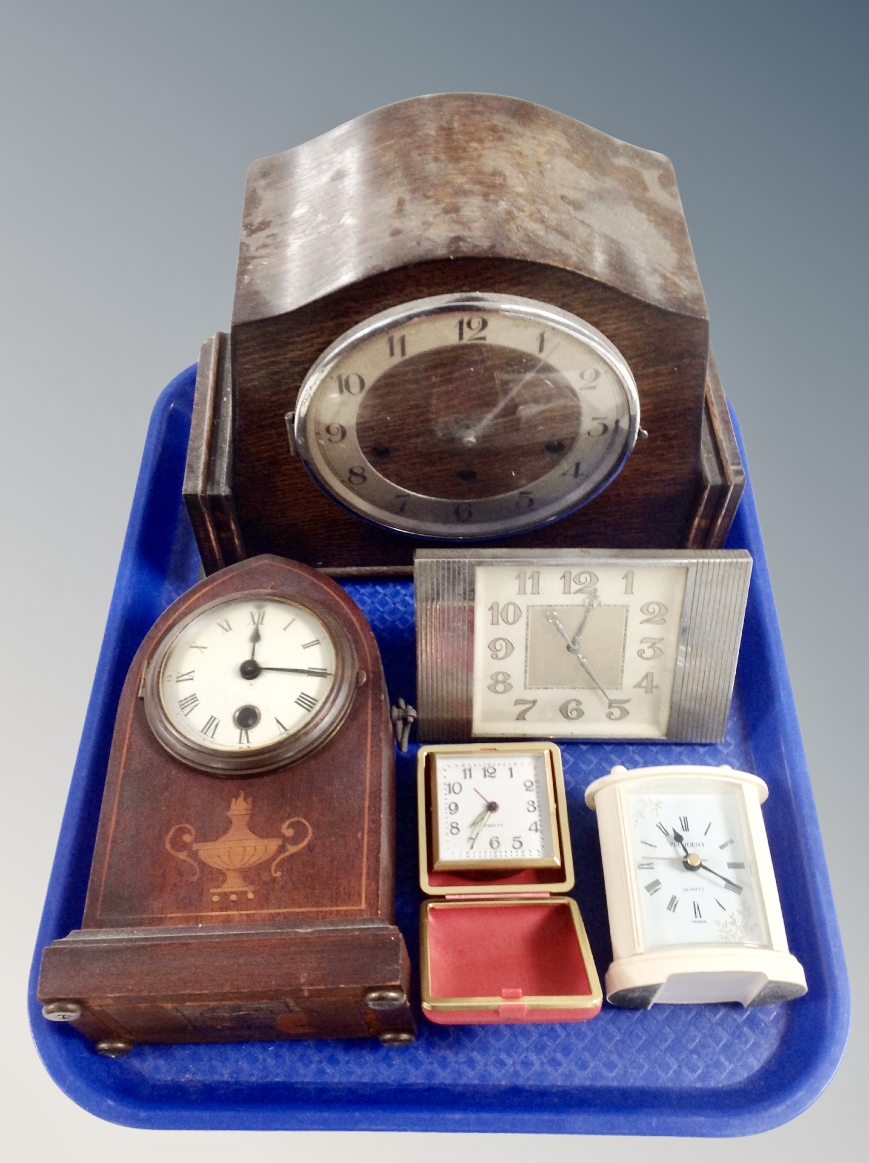 An Art Deco oak eight day mantel clock and four further mantel clocks