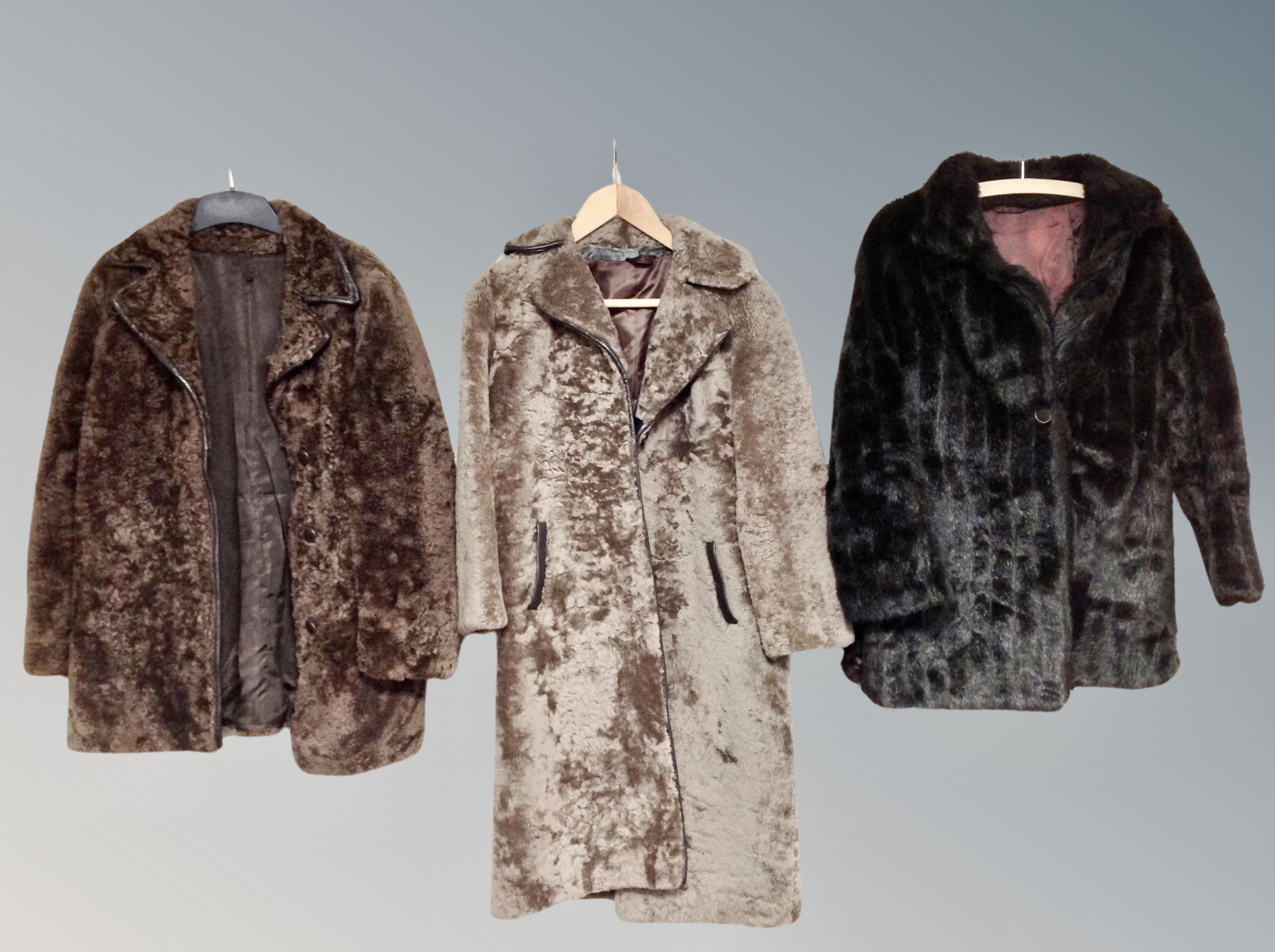 Two vintage sheepskin coats and a further synthetic fur coat