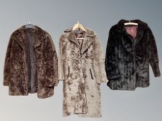 Two vintage sheepskin coats and a further synthetic fur coat