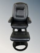 A black leather swivel armchair with stool