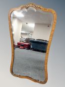 An inlaid walnut cartouche shaped mirror height 91 cm