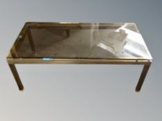 A brass and smoked glass topped rectangular coffee table,
