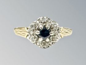 An 18ct gold and sapphire diamond cluster ring, size M CONDITION REPORT: 3.