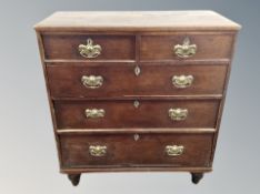 A George III oak chest of five drawers,