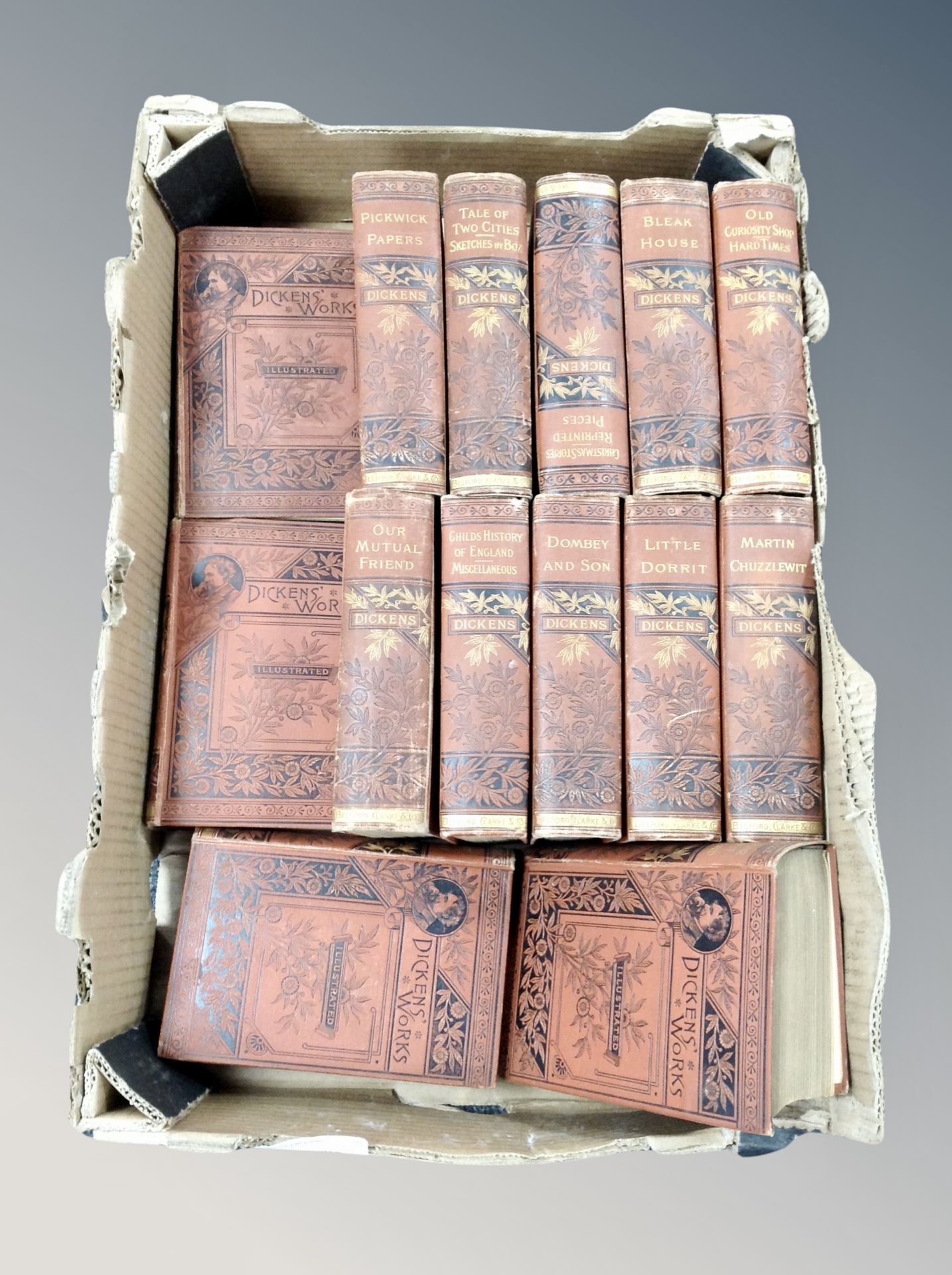 A set of fourteen Charles Dickens volumes published by Belford Clarke and Company